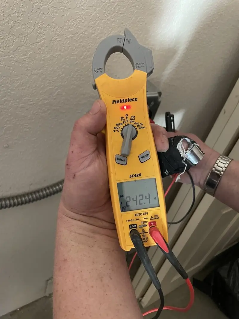 Voltage testing with clamp meter during Outlet Installation in Aliso Viejo